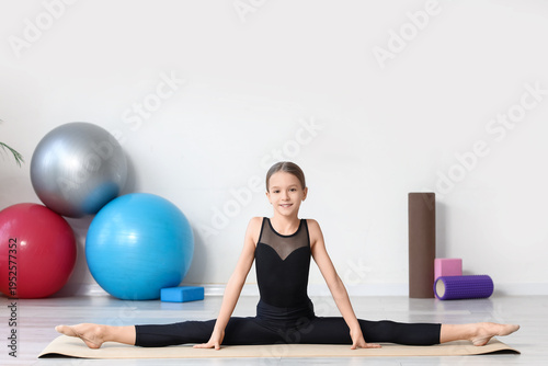 Cute girl doing gymnastics ...