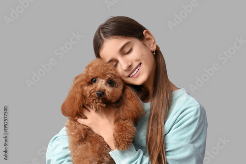 Teenage girl hugging cute T...