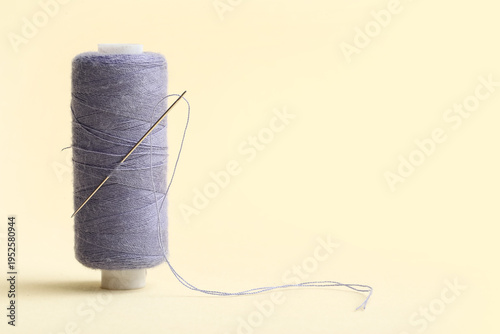 Lilac sewing thread with ne...