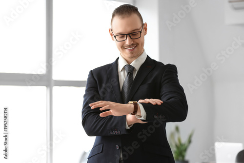 Handsome businessman lookin...