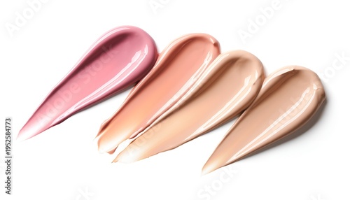 Swatches of foundation makeup on white backdrop displaying smooth creamy texture