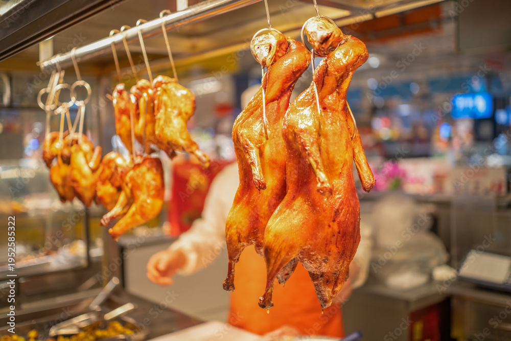 Naklejka premium Roasted Ducks Hanging in Chinese Restaurant