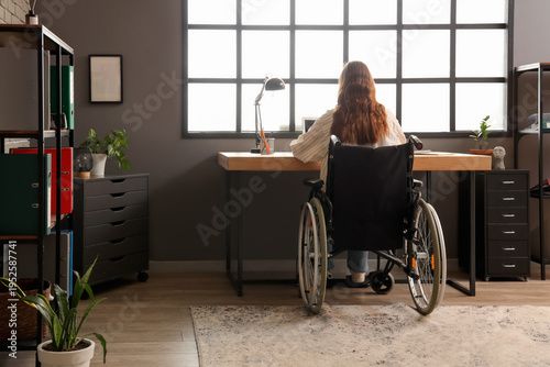 Young woman in wheelchair w...