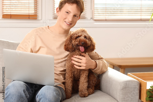 Young man using modern lapt...