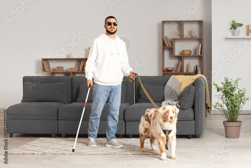 Blind young man with stick ...
