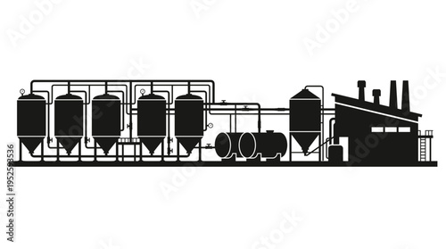 A silhouette view of an industrial facility with tanks, pipelines and storage