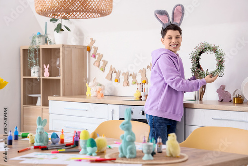 Teenage boy with bunny ears...