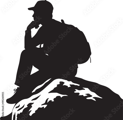 Man sitting on mountain peak with thoughtful expression outdoors