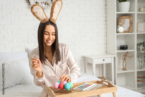 Young woman with bunny ears...