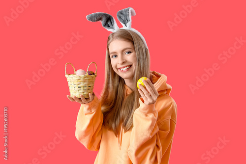 Young woman in bunny ears w...