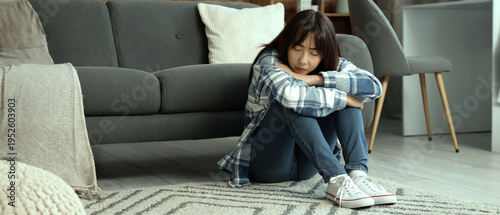 Young Asian woman with suic...