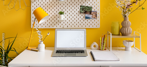 Workplace with blank laptop...
