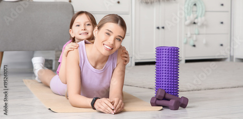 Sporty young mother and her...