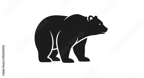 Black silhouette of a bear walking.