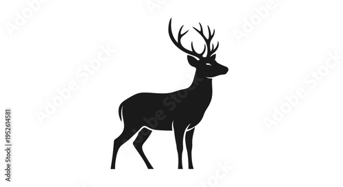Black silhouette of a deer standing.