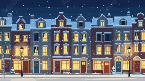 Charming European city street scene at night with colorful houses covered in snow and glowing windows under a falling snow sky.