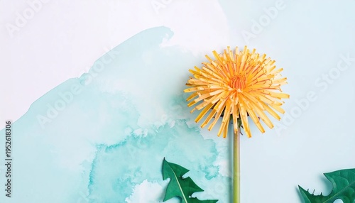 Close-up of dandelion flower with green leaves against painted aqua and white background
