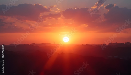 A serene landscape of a vibrant sunset over a mountain range with a peaceful sky