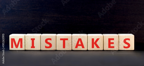 Mistakes mistake word symbol. Concept word Mistakes on beautiful wooden blocks. Beautiful black background. Business support help mistakes mistake word concept. Copy space.