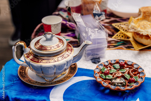 Uzbek teapot on the festive table Nauryz. hot drink on the holiday of friendship of peoples