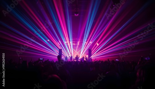 A vibrant concert scene with a crowd of people enjoying a live music performance with colorful laser lights