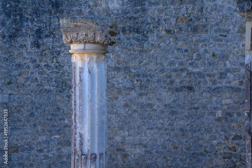textured medievil period moorish castle wall of stone with a preserved column