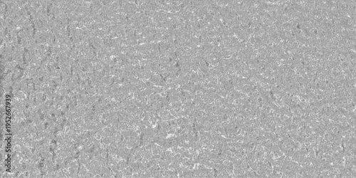 Detailed close-up of a textured metallic surface with a rippled, liquid-like pattern and subtle highlights, conveying a sense of fluidity and industrial material