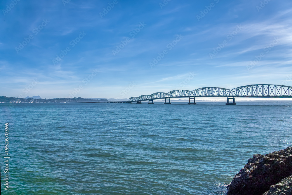 Fototapeta premium Blue sky arches over calm sea waters