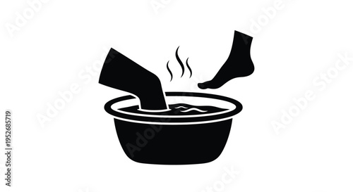 Feet soaking in a bowl of hot water steam rising