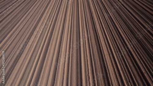 plow. Aerial view of straight, dark furrows of earth in a plowed field. travel magazines, destination branding, designed for travel destination branding, used by clinicians.