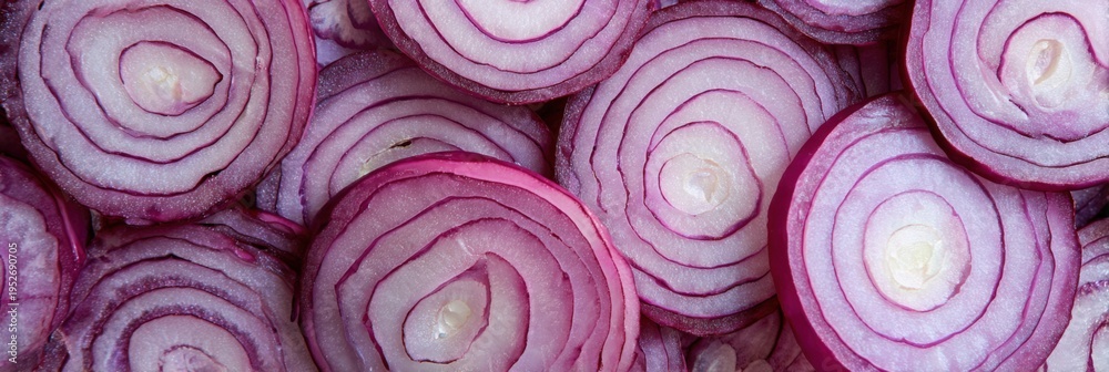 Fototapeta premium Onion slices pattern red concentric rings of sliced red onion forming a textured organic food background