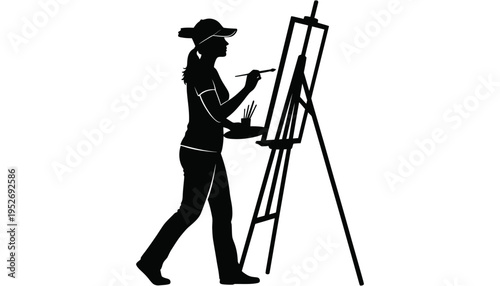 A female artist silhouette painting on an easel with a brush