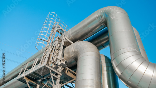 close-up of a pipeline against a blue sky