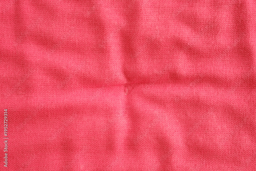 Fototapeta premium Red fabric textile material surface with texture and folds