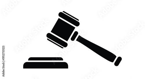 Black gavel and sounding block rest on a surface a dark silhouette