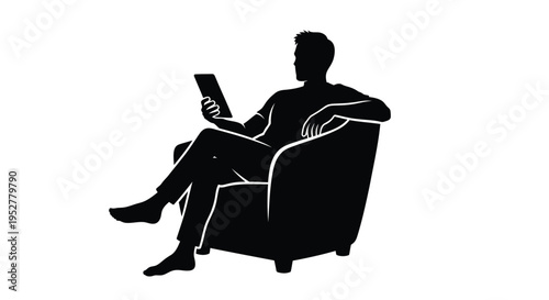 Black silhouette of a man sitting in an armchair with a tablet