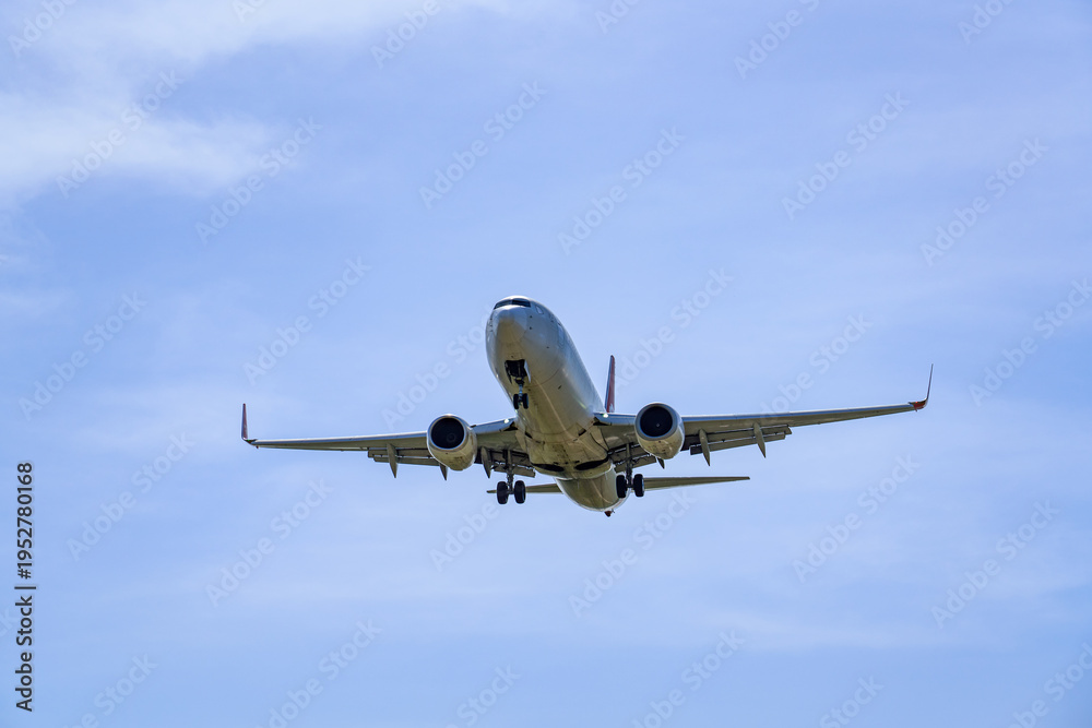Fototapeta premium Close-up of a commercial airliner approaching for landing