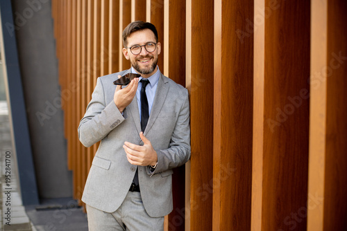 Man in suit talking on phon...