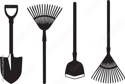 A collection of essential gardening tools including a spade, two rakes, and a hand trowel, ready for yard work.