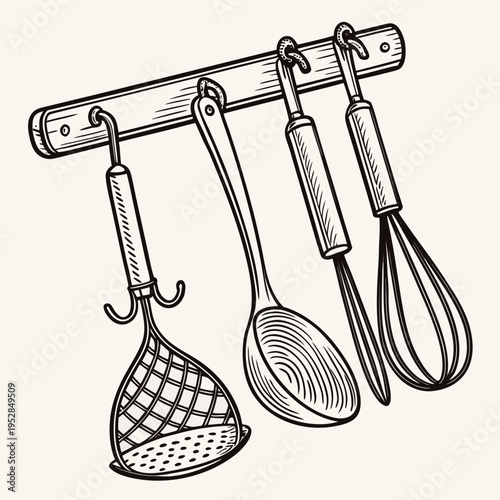 Collection of kitchen tools hanging on a wooden rack with strainer spoon whisk