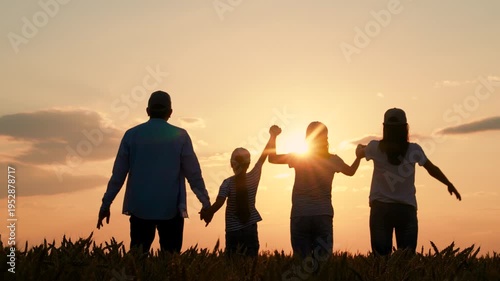 Happy family, parents kids, raising their hands sunset. Teamwork group people standing with their hands raised in wheat field. Group prayer to sun. Family business. Parents mom dad child holding hands