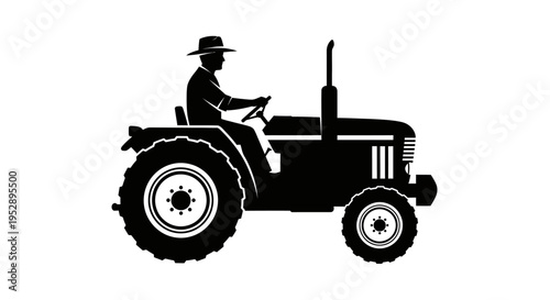 Man wearing a hat driving tractor with large wheels and a prominent exhaust pipe