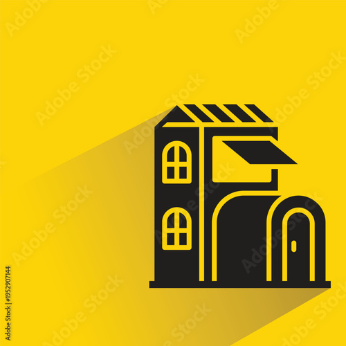 house building icon with shadow on yellow background