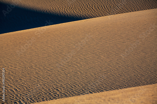 Desert Geometry: Sharp Diagonal Shadows on Sand Dunes of Death Valley.