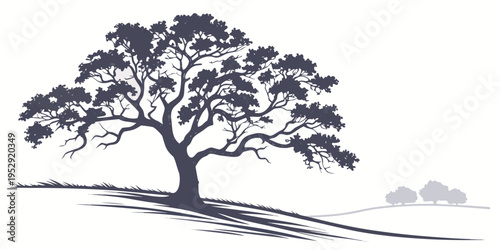 Majestic tree standing tall on a hill with a serene landscape background