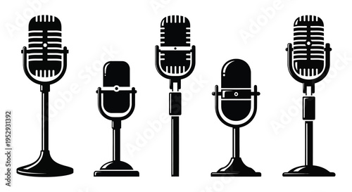 Silhouette of five classic microphones in a row