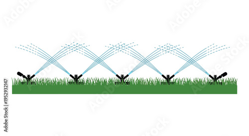 Silhouette of sprinkler system watering lawn with green grass and blue water spray in a garden silhouette