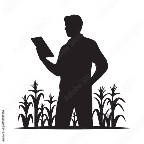 Wallpaper Mural Silhouette of a man reading a tablet in a cornfield landscape Torontodigital.ca