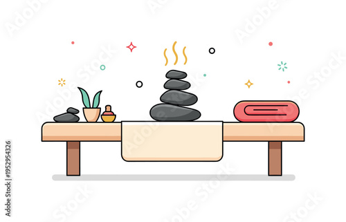Hot stone massage setup massage table prepared with neatly arranged smooth stones and folded towel at the end, suggesting warmth and therapeutic technique. A