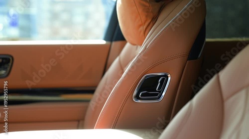 Car Seat Position Switch Buttons. Brown leather interior.